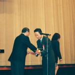 Accepting Award of Recognition from Nihon University Wrestling Club April 2002